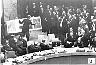 Confrontation at the United Nations, October 25, 1962: deputy  NPIC director David Parker points out the photographic  evidence while U.S. ambassador Adlai Stevenson (at right)  describes the photos. USSR ambassador Valerian Zorin is  presiding at far left.