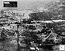 November 5, 1962: Low-level photography documents loading of  Soviet missiles at the main Mariel port facility for return  to the USSR. On  the dock are vehicles later identified by NPIC as nuclear  warhead vans.