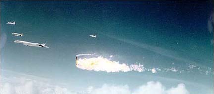 Seconds after the midair collision of Joe Walker's F-104N and Al White and Carl Cross's XB-70A. Note the stablizers are missing from the XB-70. At this point its crew was unaware of the midair collision.