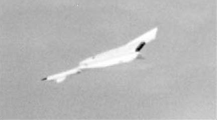 The mortally damaged XB-70 has now began to spin out of control as it descents to an inevitable crash.